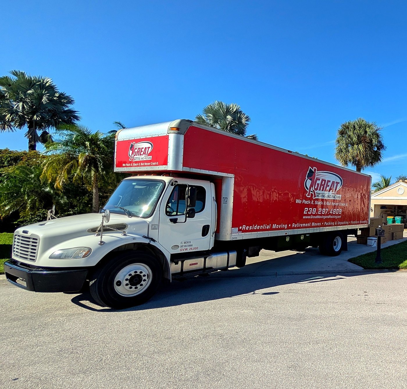 Great Moving & Packing truck under palm trees in Southwest Florida — owner-operated local movers